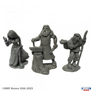 Townsfolk (Strumpet, Blacksmith, Beggar) - Three detailed gray fantasy miniatures depicting a strumpet in a dress, a blacksmith with an anvil, and a beggar with a staff.