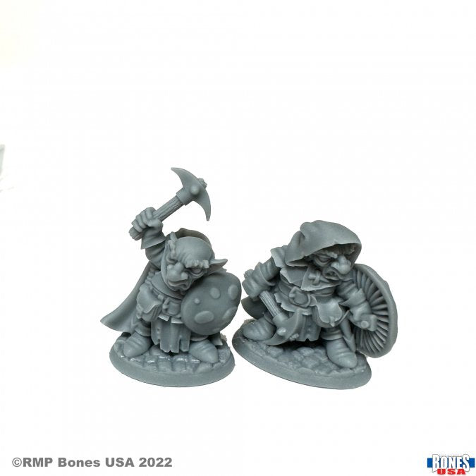 Deep Gnome Rangers (2) - Two gray plastic deep gnome ranger miniatures with shields and weapons, detailed fantasy figures.