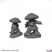 Mushroom Men (2) - Two gray unpainted resin fantasy figures resembling mushroom men with humanoid features and textured caps.