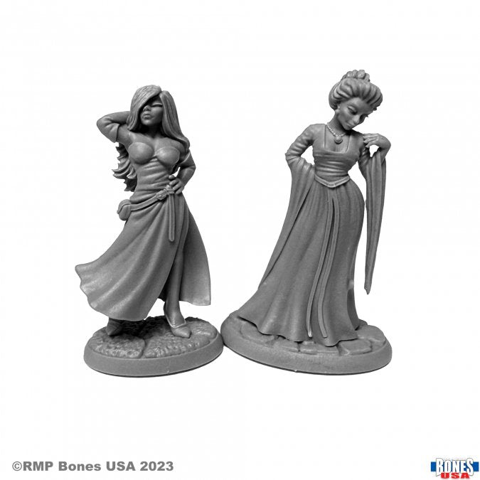Townsfolk: Courtesans (2) - Two gray resin miniatures of women in flowing medieval-style dresses, one with hand on hip and the other holding a long fan.