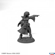 Juliette, Sorceress - Gray resin miniature of a female sorceress in flowing robes with outstretched arm and layered belts.