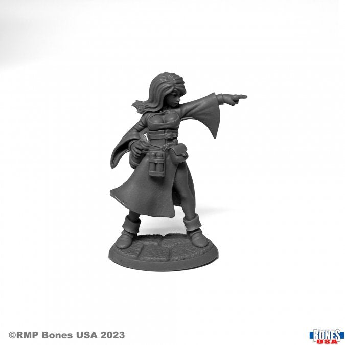 Juliette, Sorceress - Gray resin miniature of a female sorceress in flowing robes with outstretched arm and layered belts.