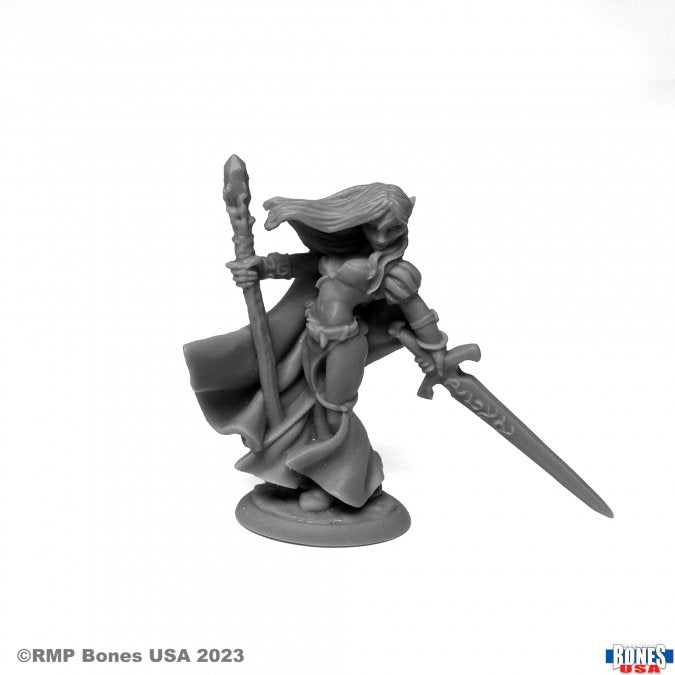 Alastriel, Elf Wizard - Gray resin miniature of a female elf wizard holding a staff and a sword, wearing a flowing cloak and armor.