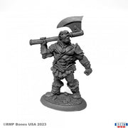 Bertok the Brave, Human Barbarian - Gray resin miniature of a muscular human barbarian holding a large battle axe over his shoulder, wearing detailed armor and.