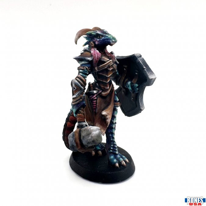 Tarmiczi, Female Dragonblood Paladin - Detailed dragonborn female warrior figurine with dark blue scales, intricate bronze armor, large shield, and a mace,.