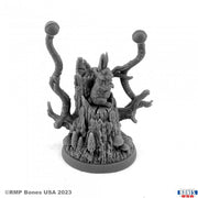 Wolf in Sheep's Clothing - Gray plastic miniature figurine featuring a wolf disguised as a rabbit with twisted branch-like antlers on a textured round.