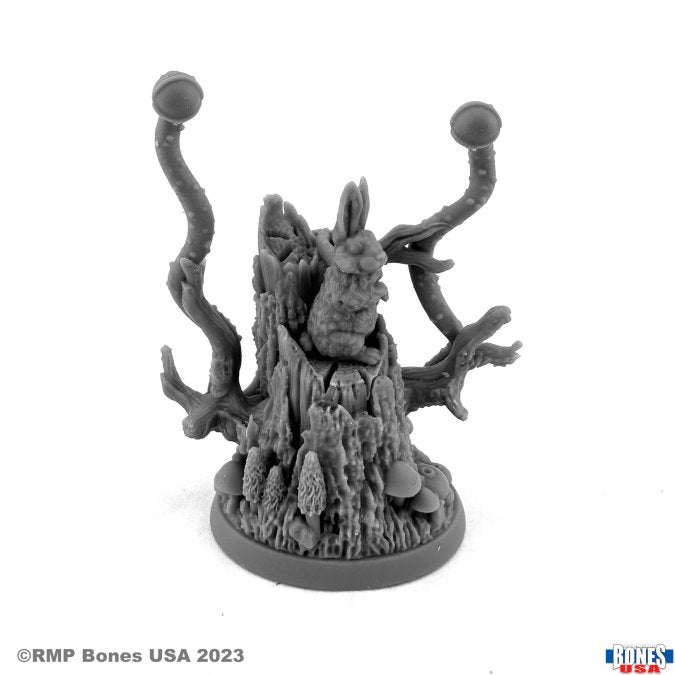 Wolf in Sheep's Clothing - Gray plastic miniature figurine featuring a wolf disguised as a rabbit with twisted branch-like antlers on a textured round.