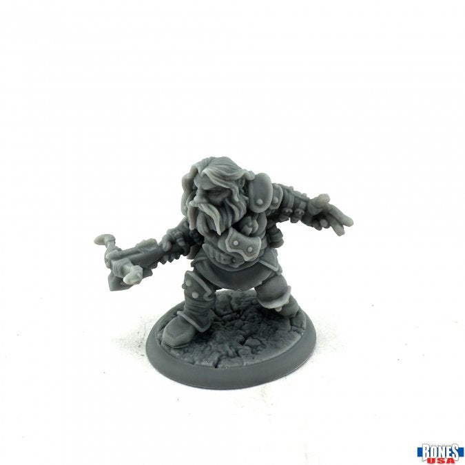 Snorri Oathbreaker, Dwarf Rogue - Gray plastic miniature of a stout dwarf rogue with long hair, armored torso, and an outstretched hand on a textured round.