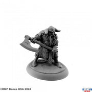 Sigurd, Viking Warrior - Gray resin miniature of a bearded Viking warrior crouching with a large battle axe, detailed armor, and horned helmet.