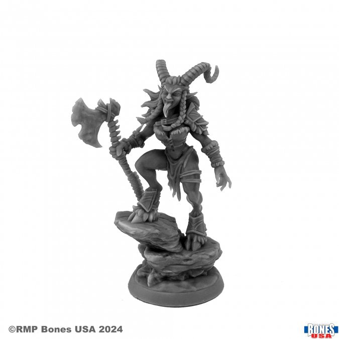 Female Krampus - Gray resin figure of a female Krampus with curved horns, holding an axe, standing on a rocky base.