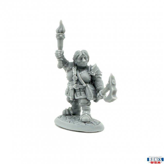 Harget Ironthumb, Dwarf Heroine - Gray miniature figurine of a dwarf heroine holding a torch in one hand and a battle axe in the other, wearing layered armor.
