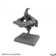Wizard #1 - Gray resin miniature of a wizard in a pointed hat casting a spell, standing on a decorated square base.