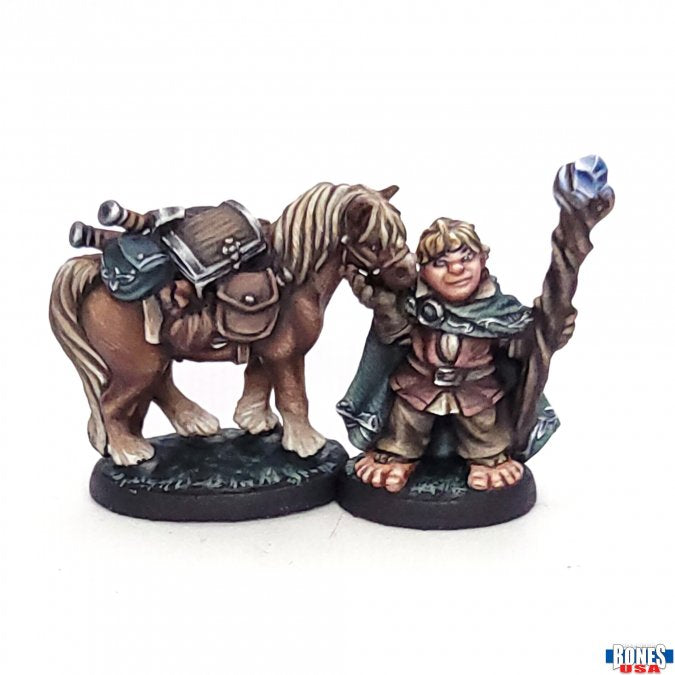 Dobbin & Boulder, Halfling and Pony (Unpainted) - Unpainted brown pony with saddle and gear beside a halfling figure holding a staff and wearing cloak.