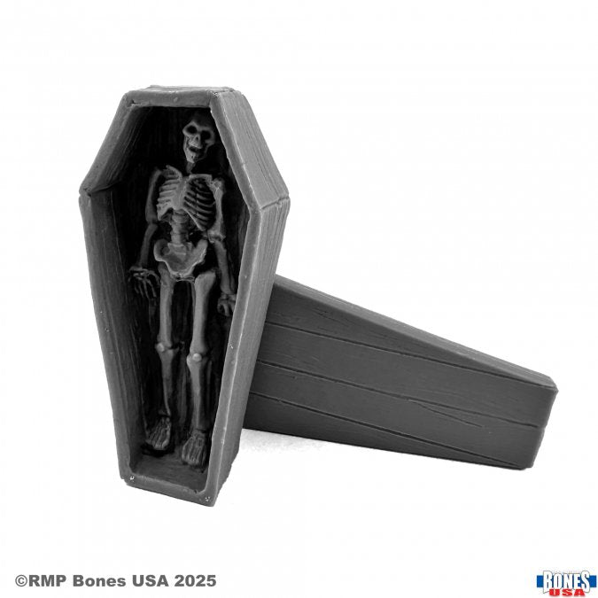 Coffin and Corpse - Gray plastic coffin with removable lid containing a detailed miniature skeleton inside.