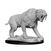 Wizkids Deep Cuts Miniatures: Saber-Toothed Tiger - Gray plastic miniature of a snarling saber-toothed tiger with detailed fur and large curved fangs on a textured oval base.