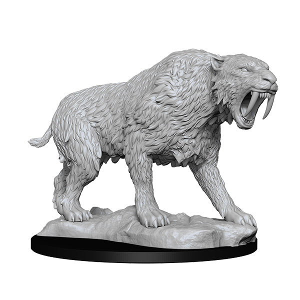 Wizkids Deep Cuts Miniatures: Saber-Toothed Tiger - Gray plastic miniature of a snarling saber-toothed tiger with detailed fur and large curved fangs on a textured oval base.