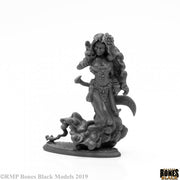 Ashana, Female Djinni - Gray unpainted resin miniature of a female djinni with flowing hair, ornate armor, and a curved blade, standing on a.