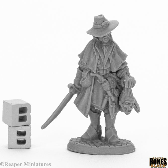 Jakob Knochengard, Human Ranger - Gray unpainted fantasy ranger miniature wearing a wide-brimmed hat, cloak, and holding a sword and a skull.