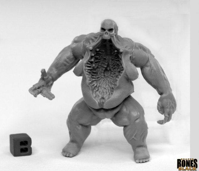 Maggotcrown Bonesack - Gray fantasy creature figure with exposed ribcage and muscular arms, standing next to a letter B block.