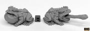 Giant Frogs (2) - Pair of detailed gray fantasy giant frog sculptures, one with extended tongue catching prey, on white background.