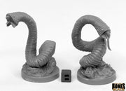 Giant Leeches (2) - Two gray plastic giant leech miniatures on round bases with segmented bodies and open mouths displaying teeth.