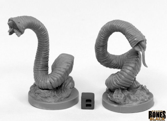 Giant Leeches (2) - Two gray plastic giant leech miniatures on round bases with segmented bodies and open mouths displaying teeth.