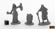 Dreadmere Townsfolk: Fishwife & Crone (2) - Two detailed gray fantasy miniatures of townsfolk, one holding a fish and axe, the other with a cane, plus a barrel of fish.