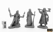 Women of Dreadmere (3) - Three detailed gray fantasy miniatures including a cloaked warrior with dual blades, a robed mage with a staff, and an.