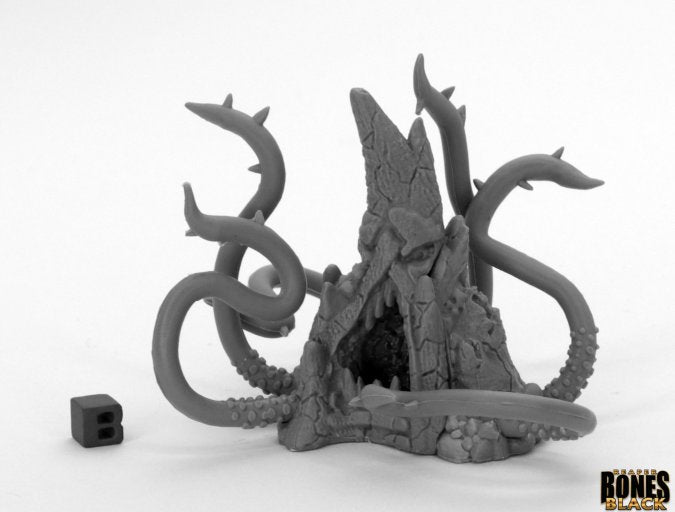 Stone Lurker - Dark stone-like fantasy creature with multiple tentacles emerging from jagged rock formations, black six-sided die nearby.
