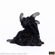 Carnivorous Pudding - Black glossy resin figurine of a dripping, amorphous creature with horn-like protrusions and textured surface.