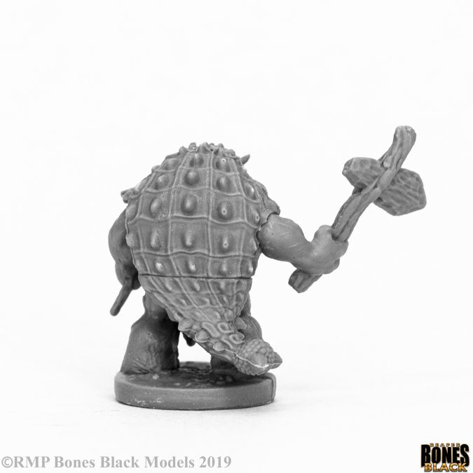 Armorback Barbarian - Gray resin fantasy barbarian miniature with spiked, armor-like shell and wielding a large axe.