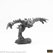 Chaos Toad Brawler - Gray miniature of a toad-like warrior with spiked back and claws, standing on rocky base.
