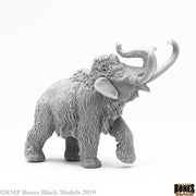 Pygmy Mammoth - Gray woolly mammoth figurine with textured fur and upward-curved tusks standing on all fours.
