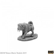 Sabertooth Pug - Gray miniature sculpture of a pug with sabertooth fangs standing on a textured base.