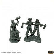 Skeletal Rum Runners (2) - Two black resin fantasy miniature skeleton pirates holding rum bottles, one sitting on a barrel, the others standing on bases.
