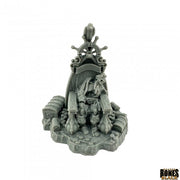 Dead Men Tell No Tales - Gray resin miniature of a cloaked skeletal pirate seated on a throne adorned with skulls and treasure chests.