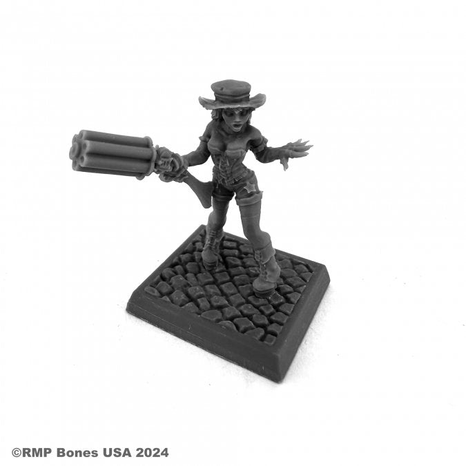 Dixie Dynamite, Steampunk Cowgirl - Steampunk cowgirl miniature with a top hat, long coat, and multi-barrel gun on cobblestone base.