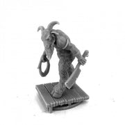 Cryptid Goatman - Gray miniature figurine of a goat-headed humanoid wielding a cleaver and holding a ring, standing on a wooden plank base.