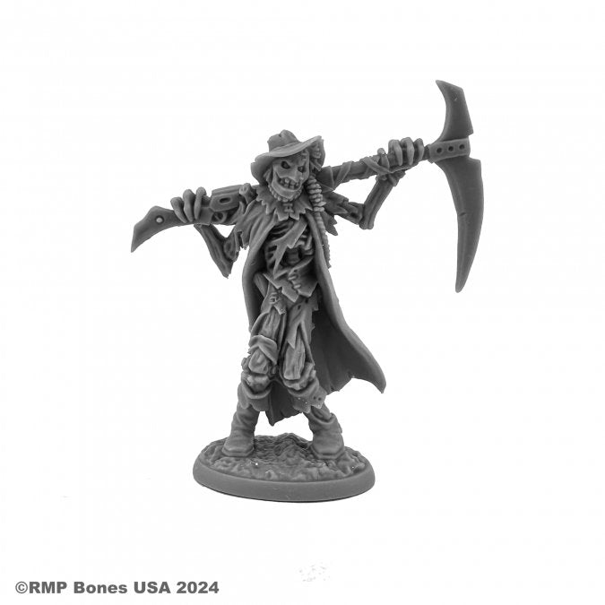Wild West Oz - Scarecrow - Gray plastic miniature of a scarecrow figure wearing a tattered coat and hat, holding a large scythe over its shoulders,.
