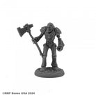 Wild West Oz - Tin Man - Dark gray metallic humanoid robot figure holding a large battle axe, standing on a round textured base.