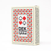DEK Playing Cards: lykke (PREORDER) - Playing cards box featuring a white background with red and black heart, diamond, club, and spade symbols and the text "DEK.