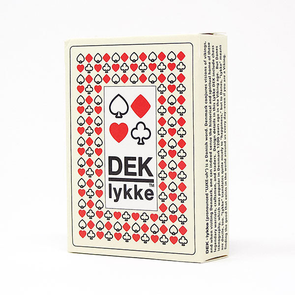 DEK Playing Cards: lykke (PREORDER) - Playing cards box featuring a white background with red and black heart, diamond, club, and spade symbols and the text "DEK.