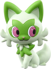 Takaratomy Pokemon Figure Collection - Sprigatito - Small green and white Sprigatito Pokemon figure with large pink eyes and pointed ears.