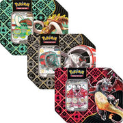 Pokemon Scarlet and Violet Paldean Fates Tin - Three rectangular Pokémon Scarlet and Violet Paldean Fates tins with intricate geometric background patterns in teal, gold,.