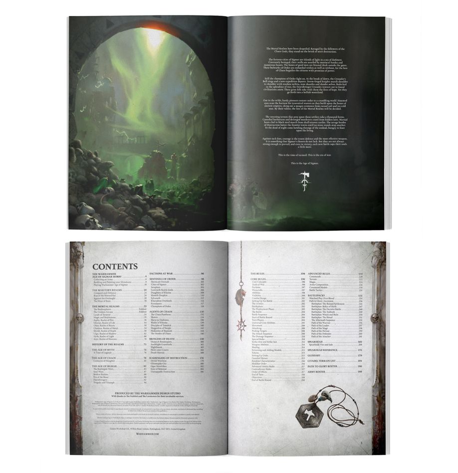 Warhammer Age of Sigmar - Core Book - Open Warhammer Age of Sigmar Core Book showing a full-color fantasy illustration with green aurora and dark cavern on left.