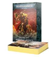 Warhammer 40,000 - Datasheet Cards - Imperial Agents - Stack of yellow-edged Warhammer 40,000 datasheet cards with detailed artwork, next to a box featuring a golden-armored.