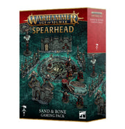 Warhammer Age of Sigmar: Spearhead: Sand & Bone Gaming Pack - Warhammer Age of Sigmar Spearhead Sand & Bone Gaming Pack box with detailed fantasy battlefield artwork and dark green tones.