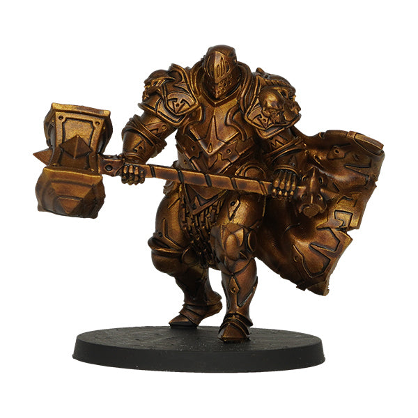 Vallejo True Metallic Metal Shade: Arcane Gold (18ml) - Metallic gold-painted fantasy warrior miniature holding a large hammer and shield on a black base.
