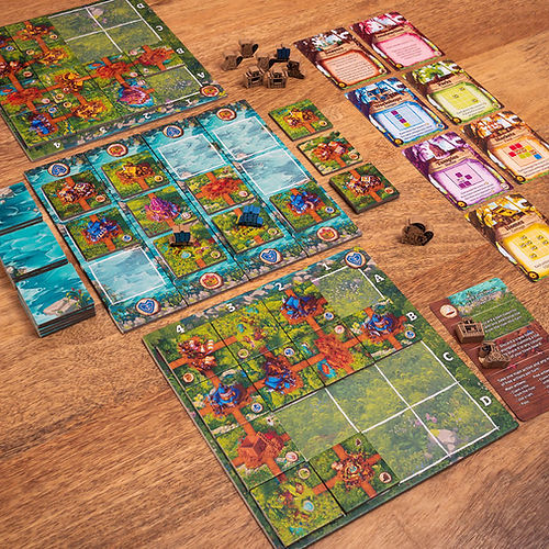 Timber Town - Wooden table setup of Timber Town board game with colorful, illustrated cards, tokens, and game boards arranging floral and.