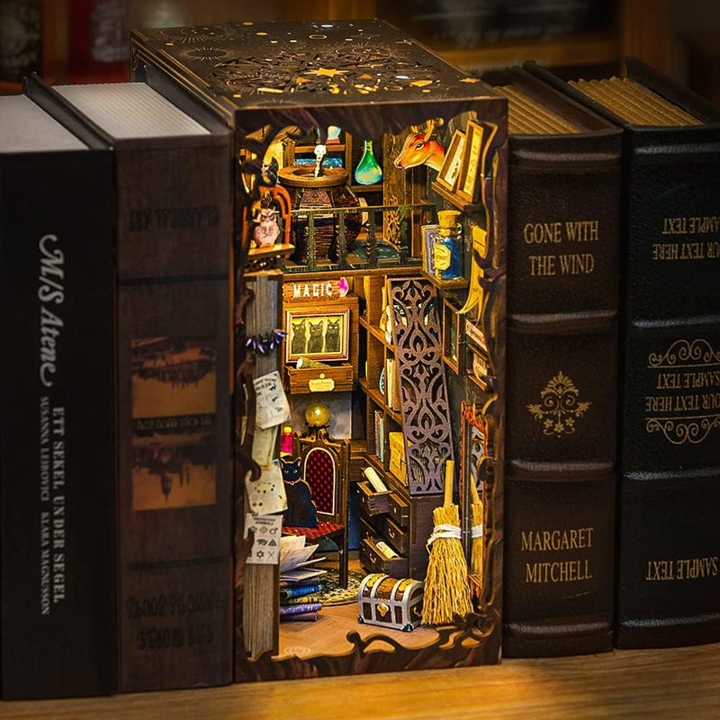 Magic Pharmacist Book Nook (PREORDER) - Miniature book nook designed as a magical pharmacist’s cabinet with glowing shelves, potions, books, and mystical decor in.